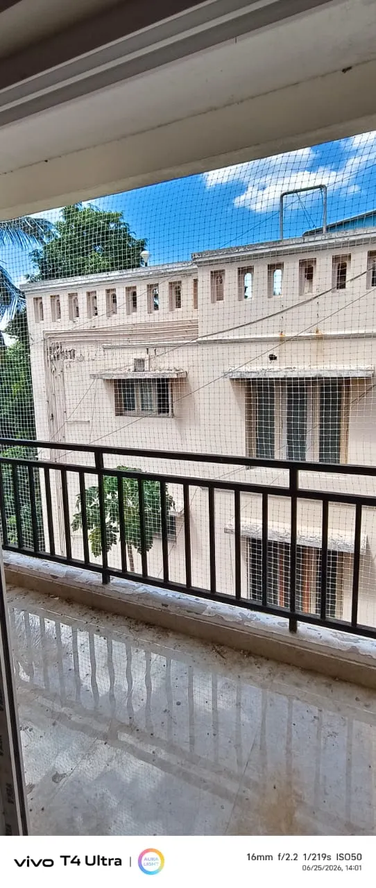 Bird net fitted to a first-floor balcony of a residential building
